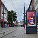 Street with a screen on which the UW/H campaign can be seen