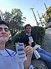 Photo of two young men wearing an election worker's ID card around their necks.