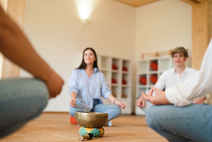 Four people in meditation