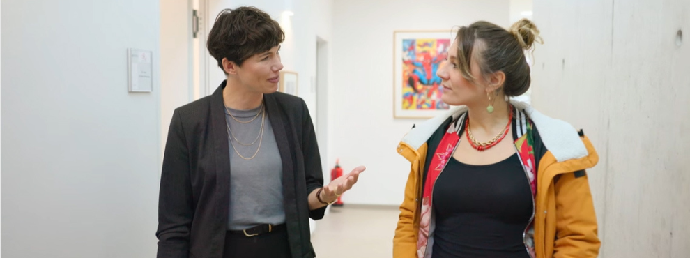 Two women in conversation.