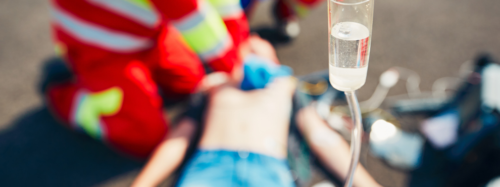 A blurred resuscitation scene on a street